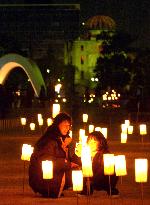 Candles lit around Atomic Bomb Dome